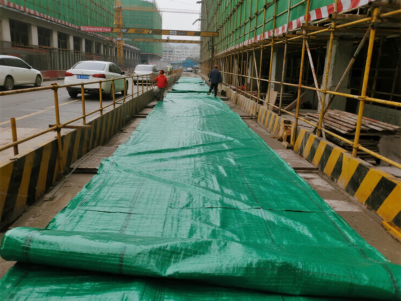 Heavy equipment driving on temporary path cloth