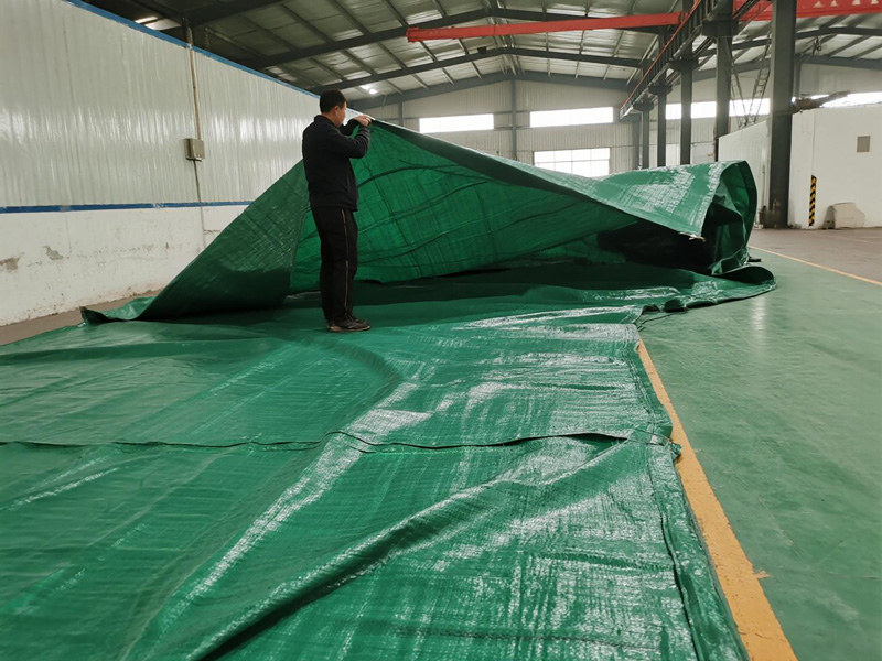 Emergency tarp deployment showing quick-connect features and secure anchoring