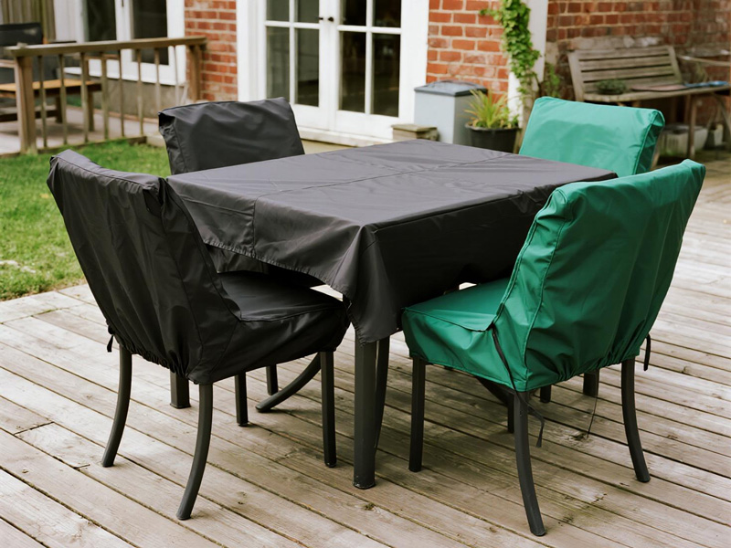 Table and chair covers showing secure fit system and design details