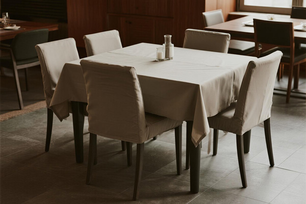 Indoor dining room with protected table and chairs