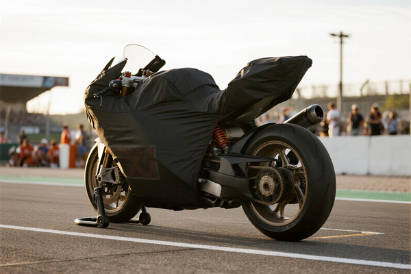 Covered sport motorcycle in driveway