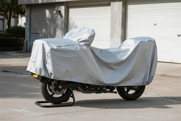 Covered touring motorcycle in garage