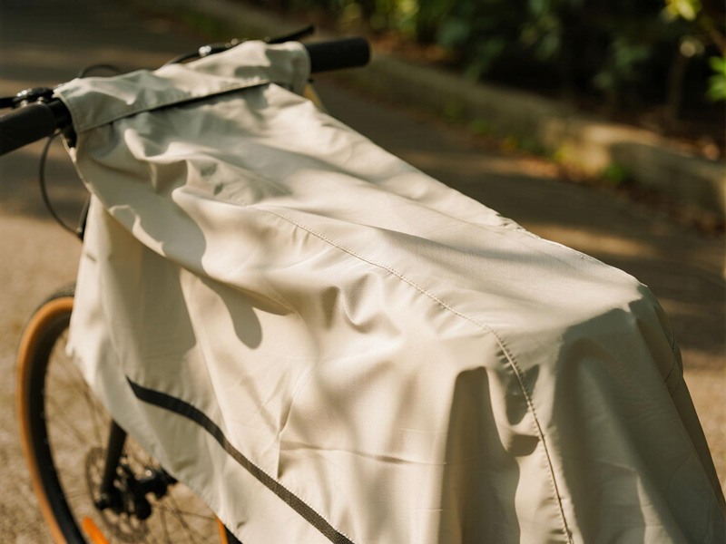 Bicycle cover in rainy conditions showing waterproof properties