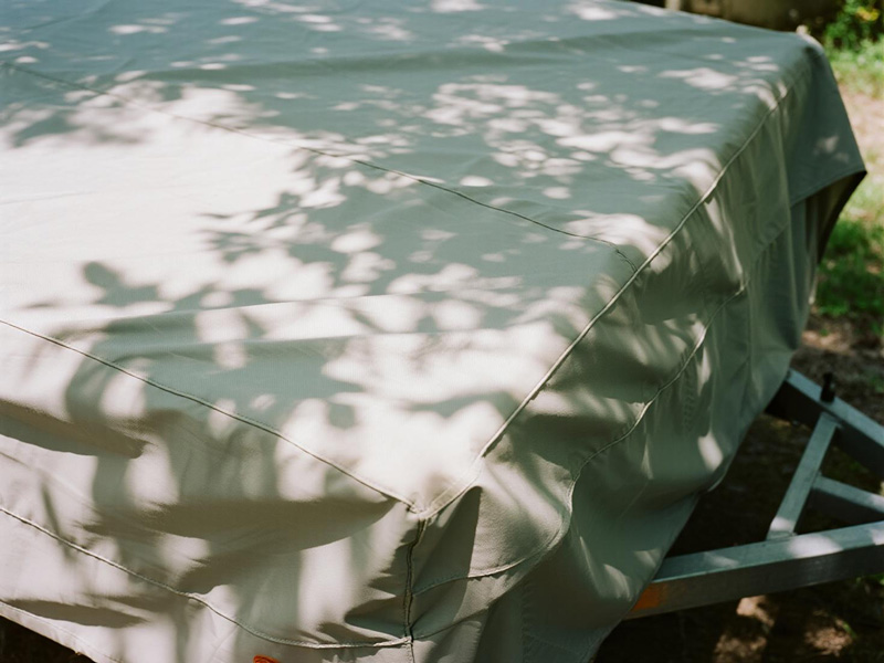Close-up of Oxford fabric trailer cover showing heavy-duty construction