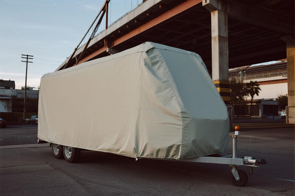 Covered cargo trailer in outdoor storage
