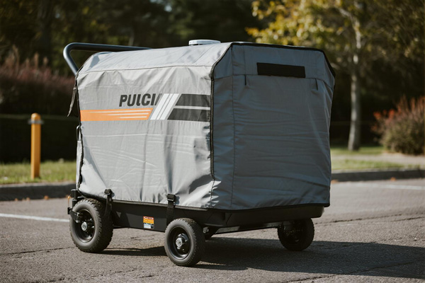 Covered portable generator in residential backyard