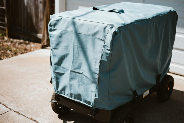Covered standby generator outside home