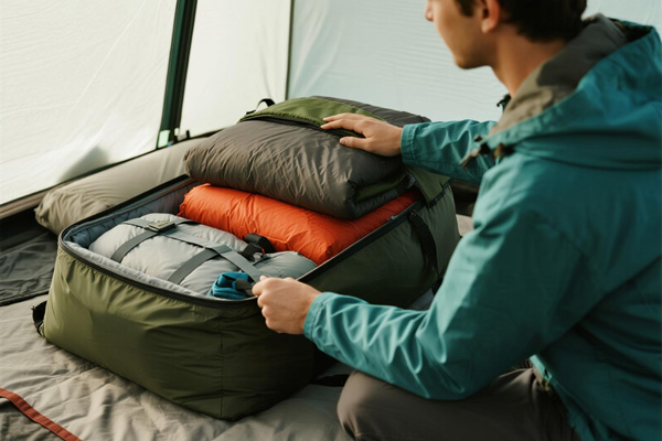 Sleeping bags and pads in storage cover
