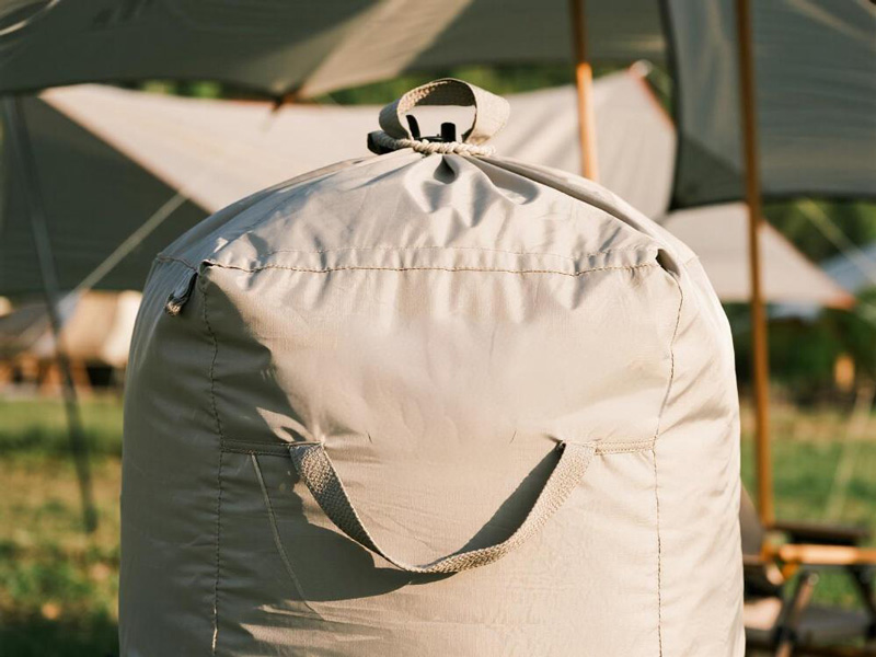 Compact storage of tent accessory cover in camping setup