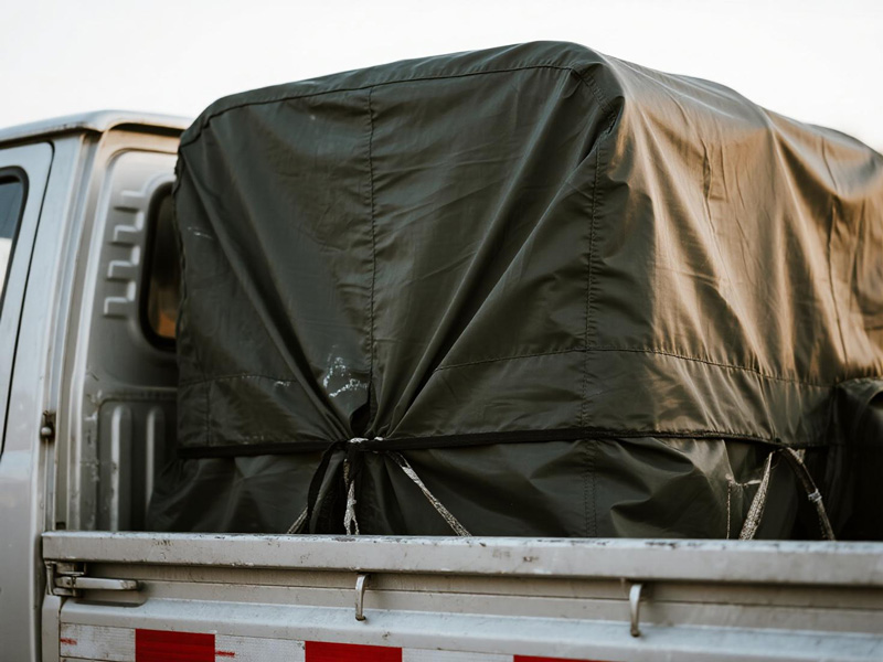 Close-up of Oxford fabric cargo cover showing reinforced seams and durable construction