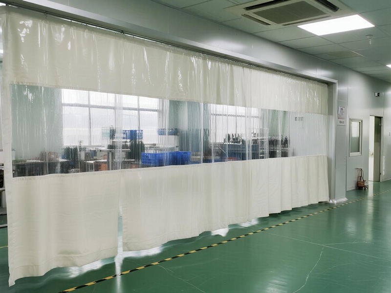 Close-up of fire-resistant partition curtain showing durable fabric and fire-retardant coating