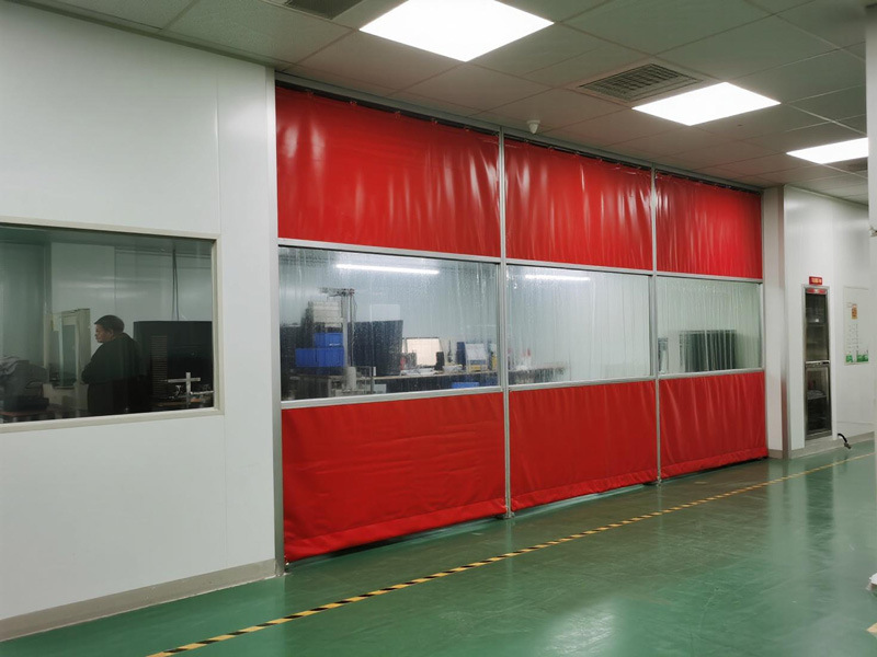 Workshop partition curtain system showing track and sliding functionality