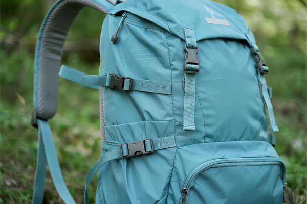 Hiking backpack made with lightweight waterproof fabric in mountain setting