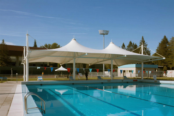 Swimming pool area with decorative shade sails