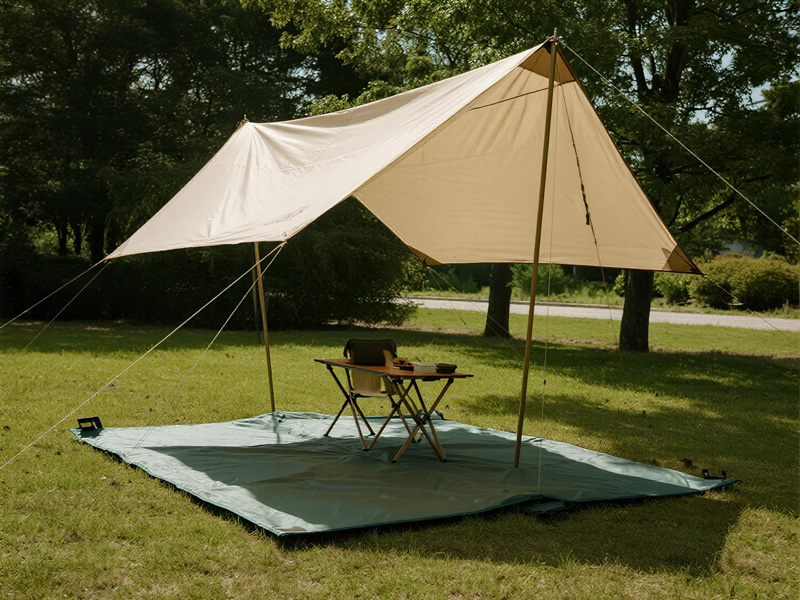 Tarp folded compactly for storage in camping bag