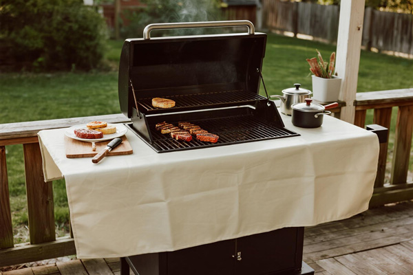 BBQ mat used as preparation area next to grill