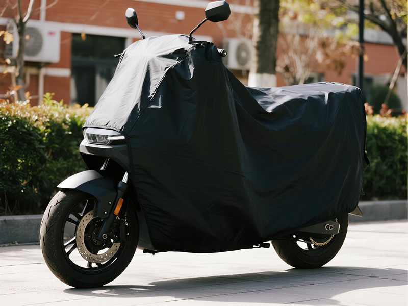 Close-up of durable bike cover fabric showing waterproof coating and reinforced seams