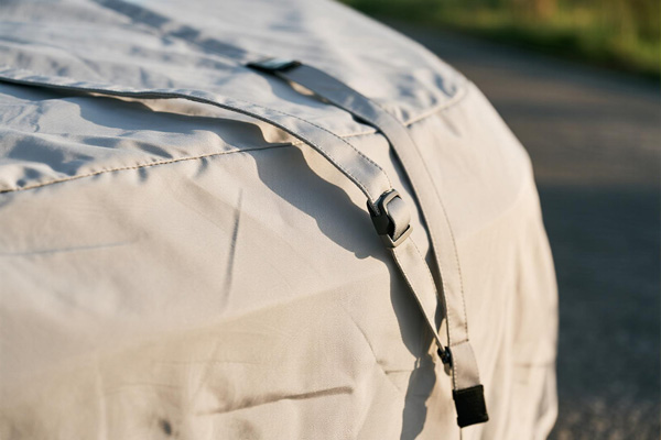 Traveler using bike cover at campsite