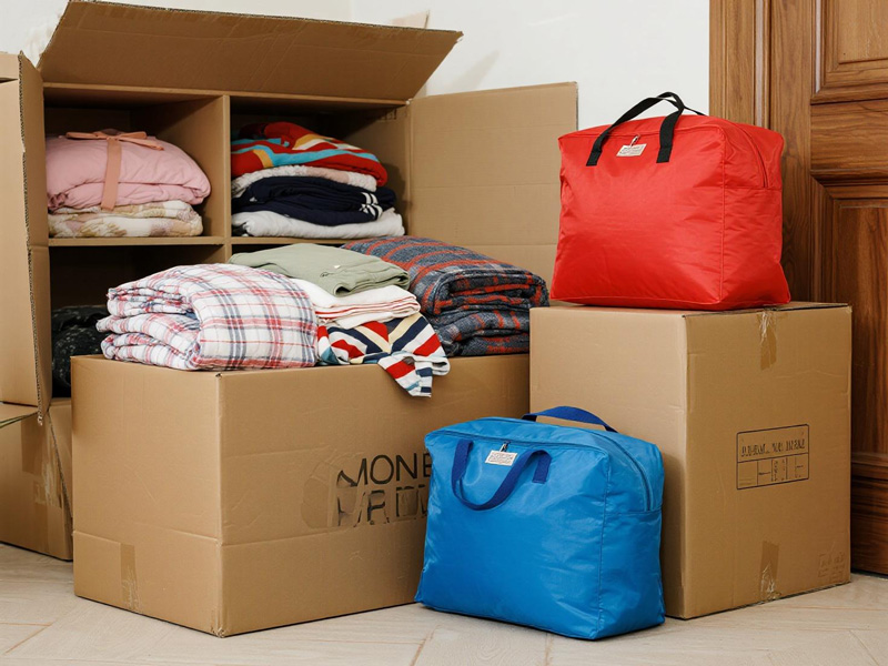 Large moving storage bags filled with household items