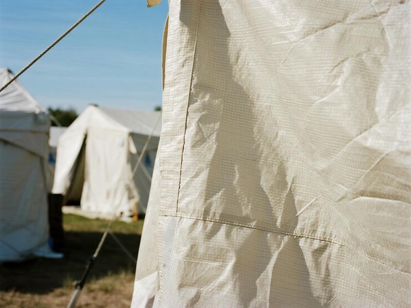 Cross-section view of multi-layer isolation tent fabric showing waterproof and breathable membrane
