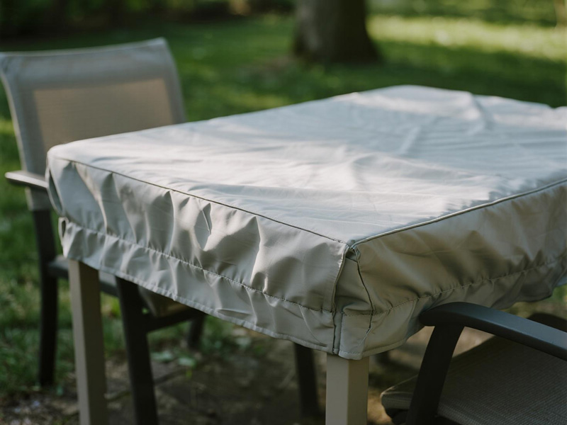 Outdoor sofa with fitted protective cover