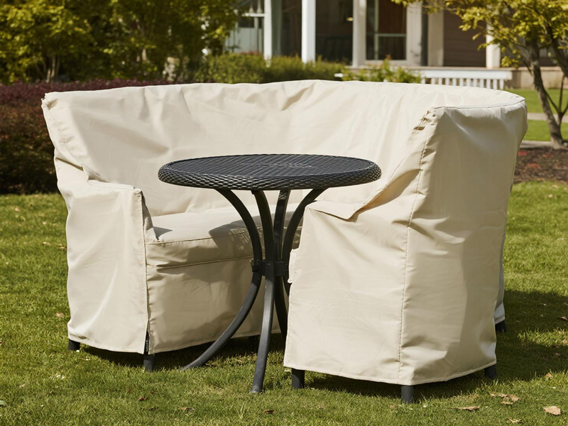 Close-up view of heavy-duty outdoor furniture cover material showing weave and waterproof backing