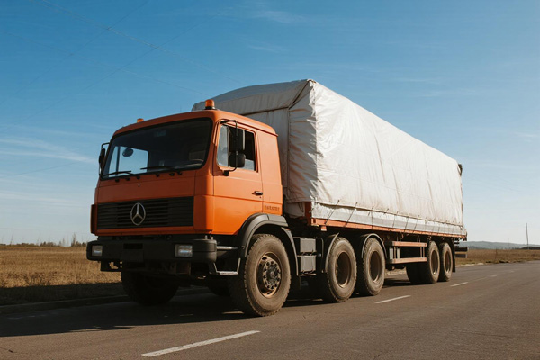 Heavy duty PVC cargo tarpaulins covering truck loads